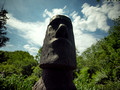 Moai with foliage moving in the wind.